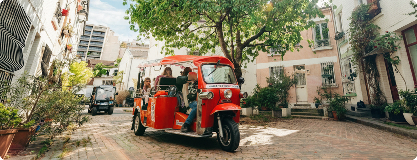 Paris tuktuk parked on a tree-lined neighborhood street