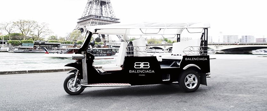 Black electric tuktuk with Balenciaga branding, Tuktuk Ride Paris communication campaign