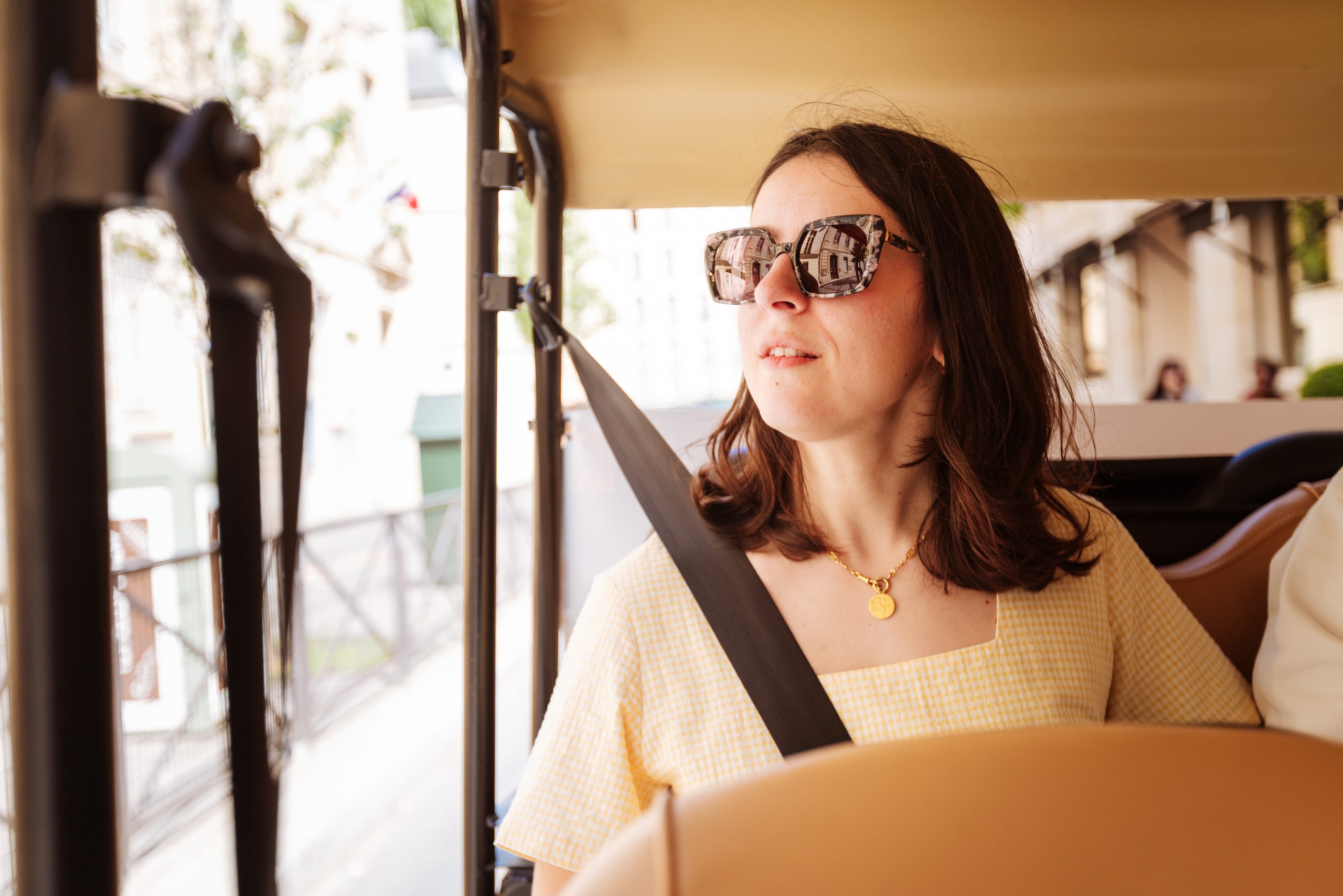 Passenger enjoying a Paris tour in an electric tuktuk